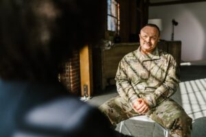 a US Army veteran sitting down with a counselor